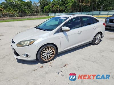 2014 FORD FOCUS TITANIUM 1FADP3J21EL240653 - główne zdjęcie licytacji z USA - miniatura