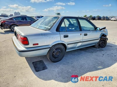 Trzecie zdjęcie samochodu z tyłu: 1992 TOYOTA COROLLA DELUXE VIN:1NXAE94A6NZ378543 - miniatura