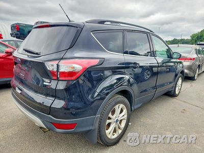 Trzecie zdjęcie samochodu z tyłu: 2018 FORD ESCAPE SE VIN:1FMCU9GD2JUC38341 - miniatura