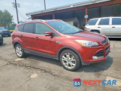 Czwarte zdjęcie samochodu z boku: 2016 FORD ESCAPE TITANIUM VIN:1FMCU9JX8GUA65646 - miniatura