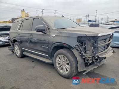 Czwarte zdjęcie samochodu z boku: 2022 GMC YUKON SLT VIN:1GKS1BKD6NR321386 - miniatura