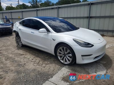 Czwarte zdjęcie samochodu z boku: 2018 TESLA MODEL 3 VIN:5YJ3E1EB4JF117792 - miniatura