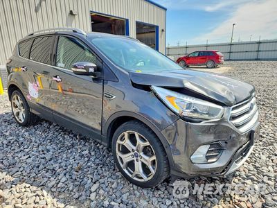 Czwarte zdjęcie samochodu z boku: 2017 FORD ESCAPE TITANIUM VIN:1FMCU9J92HUB97711 - miniatura