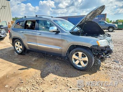 Czwarte zdjęcie samochodu z boku: 2013 JEEP GRAND CHEROKEE OVERLAND VIN:1C4RJFCT0DC525559 - miniatura