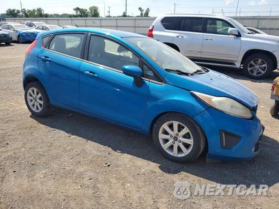 Czwarte zdjęcie samochodu z boku: 2012 FORD FIESTA SE VIN:3FADP4EJ1CM187794 - miniatura