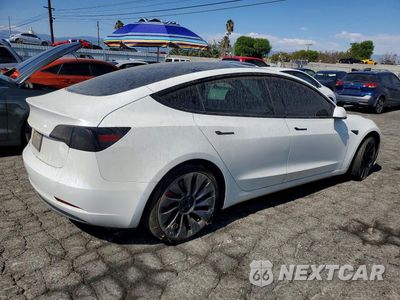 Trzecie zdjęcie samochodu z tyłu: 2021 TESLA MODEL 3 VIN:5YJ3E1ECXMF072225 - miniatura