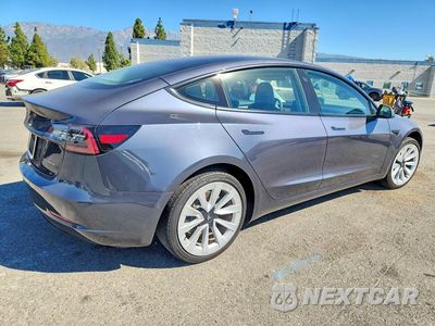 Trzecie zdjęcie samochodu z tyłu: 2022 TESLA MODEL 3 VIN:5YJ3E1EB5NF325864 - miniatura