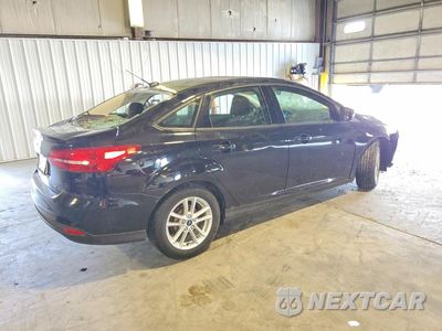 Trzecie zdjęcie samochodu z tyłu: 2017 FORD FOCUS SE VIN:1FADP3F21HL348039 - miniatura