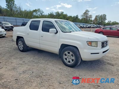 Czwarte zdjęcie samochodu z boku: 2006 HONDA RIDGELINE RTL VIN:2HJYK16546H509935 - miniatura