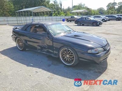 Czwarte zdjęcie samochodu z boku: 1997 FORD MUSTANG COBRA VIN:1FALP46V6VF151583 - miniatura