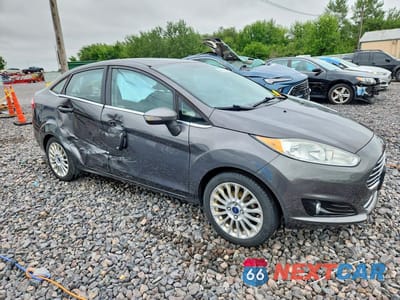 Czwarte zdjęcie samochodu z boku: 2015 FORD FIESTA TITANIUM VIN:3FADP4CJXFM105777 - miniatura