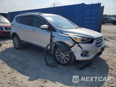 Czwarte zdjęcie samochodu z boku: 2017 FORD ESCAPE TITANIUM VIN:1FMCU9J9XHUC63132 - miniatura