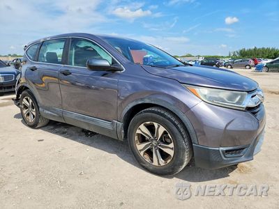 Czwarte zdjęcie samochodu z boku: 2019 HONDA CR-V LX VIN:2HKRW5H3XKH410201 - miniatura