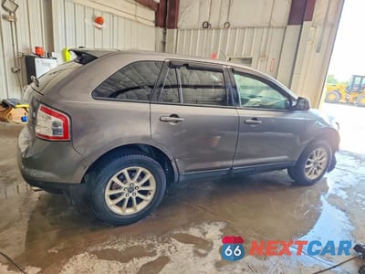 Trzecie zdjęcie samochodu z tyłu: 2010 FORD EDGE SEL VIN:2FMDK3JC4ABA18888 - miniatura