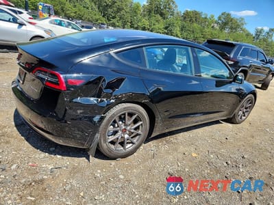 Trzecie zdjęcie samochodu z tyłu: 2018 TESLA MODEL 3 VIN:5YJ3E1EB6JF128082 - miniatura