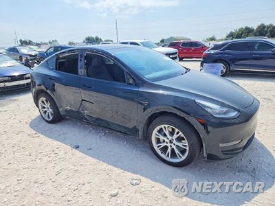 Czwarte zdjęcie samochodu z boku: 2023 TESLA MODEL Y VIN:7SAYGDEE8PA047637 - miniatura