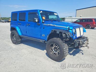 Czwarte zdjęcie samochodu z boku: 2014 JEEP WRANGLER UNLIMITED SAHARA VIN:1C4BJWEG7EL158713 - miniatura
