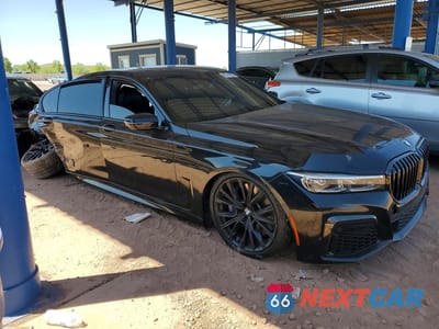 Czwarte zdjęcie samochodu z boku: 2022 BMW 750 XI VIN:WBA7U2C04NCJ56975 - miniatura
