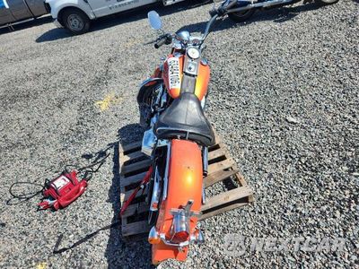Czwarte zdjęcie samochodu z boku: 2012 HARLEY-DAVIDSON FLSTN SOFTAIL DELUXE VIN:1HD1JDV18CB043325 - miniatura
