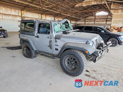 Czwarte zdjęcie samochodu z boku: 2018 JEEP WRANGLER SPORT VIN:1C4GJWAG0JL929860 - miniatura