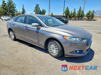 Czwarte zdjęcie samochodu z boku: 2014 FORD FUSION SE PHEV VIN:3FA6P0PUXER256237 - miniatura