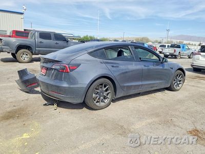 Trzecie zdjęcie samochodu z tyłu: 2023 TESLA MODEL 3 VIN:5YJ3E1EA2PF459094 - miniatura