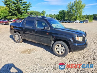Czwarte zdjęcie samochodu z boku: 2007 HONDA RIDGELINE RTL VIN:2HJYK16537H550915 - miniatura