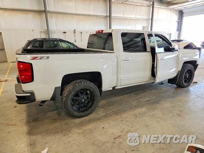 Trzecie zdjęcie samochodu z tyłu: 2017 CHEVROLET SILVERADO K1500 LT VIN:3GCUKREC8HG216012 - miniatura