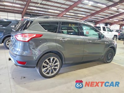 Trzecie zdjęcie samochodu z tyłu: 2015 FORD ESCAPE SE VIN:1FMCU9G98FUA56517 - miniatura
