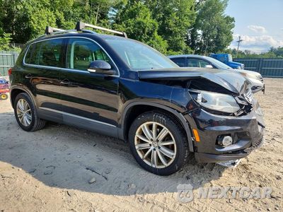 Czwarte zdjęcie samochodu z boku: 2014 VOLKSWAGEN TIGUAN S VIN:WVGBV3AX3EW566595 - miniatura