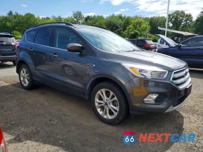 Czwarte zdjęcie samochodu z boku: 2018 FORD ESCAPE SE VIN:1FMCU9GD9JUB92099 - miniatura