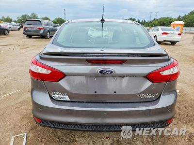 Zdjęcie 6 z 12 samochodu: 2014 FORD FOCUS TITANIUM VIN:1FADP3J25EL396968 - miniatura