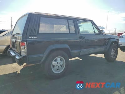 Trzecie zdjęcie samochodu z tyłu: 1990 JEEP CHEROKEE LAREDO VIN:1J4FJ57L0LL286627 - miniatura
