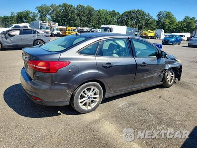 Trzecie zdjęcie samochodu z tyłu: 2016 FORD FOCUS SE VIN:1FADP3F20GL377417 - miniatura