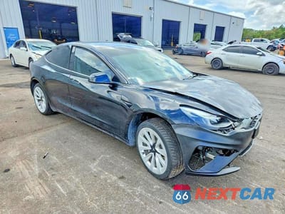Czwarte zdjęcie samochodu z boku: 2023 TESLA MODEL 3 VIN:5YJ3E1EA1PF451794 - miniatura