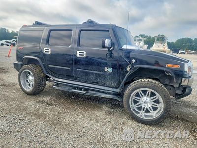 Czwarte zdjęcie samochodu z boku: 2004 HUMMER H2 VIN:5GRGN23U74H101780 - miniatura
