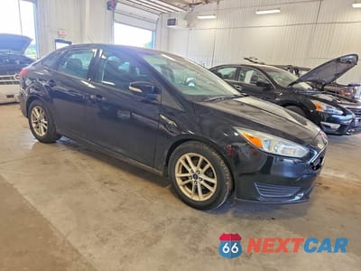 Czwarte zdjęcie samochodu z boku: 2016 FORD FOCUS SE VIN:1FADP3F28GL282216 - miniatura