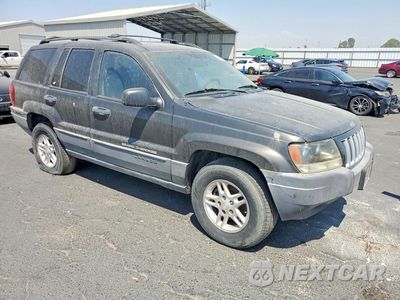 Czwarte zdjęcie samochodu z boku: 2004 JEEP GRAND CHEROKEE LAREDO VIN:1J4GW48SX4C400026 - miniatura
