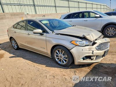 Czwarte zdjęcie samochodu z boku: 2017 FORD FUSION SE HYBRID VIN:3FA6P0LU4HR386492 - miniatura
