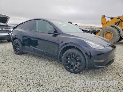 Czwarte zdjęcie samochodu z boku: 2022 TESLA MODEL Y VIN:7SAYGAEE7NF490036 - miniatura
