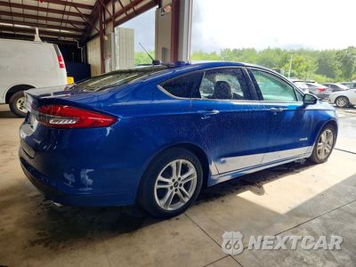 Trzecie zdjęcie samochodu z tyłu: 2018 FORD FUSION S HYBRID VIN:3FA6P0UU1JR122926 - miniatura