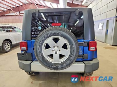 Zdjęcie 6 z 12 samochodu: 2010 JEEP WRANGLER UNLIMITED SAHARA VIN:1J4BA5H13AL162974 - miniatura