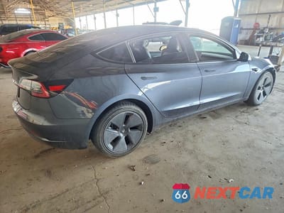 Trzecie zdjęcie samochodu z tyłu: 2023 TESLA MODEL 3 VIN:5YJ3E1EA3PF613456 - miniatura