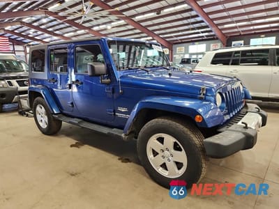 Czwarte zdjęcie samochodu z boku: 2010 JEEP WRANGLER UNLIMITED SAHARA VIN:1J4BA5H13AL162974 - miniatura