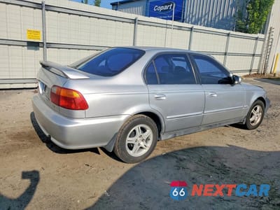 Trzecie zdjęcie samochodu z tyłu: 1999 HONDA CIVIC LX VIN:1HGEJ6672XL014454 - miniatura