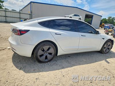 Trzecie zdjęcie samochodu z tyłu: 2023 TESLA MODEL 3 VIN:5YJ3E1EA5PF489884 - miniatura