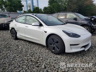 Czwarte zdjęcie samochodu z boku: 2021 TESLA MODEL 3 VIN:5YJ3E1EA8MF100764 - miniatura
