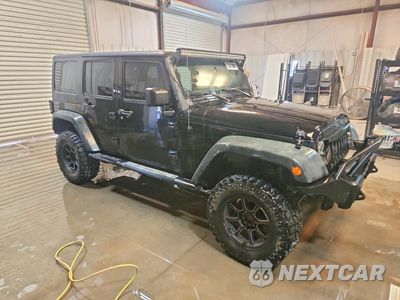 Czwarte zdjęcie samochodu z boku: 2014 JEEP WRANGLER UNLIMITED SPORT VIN:1C4BJWDG4EL139361 - miniatura