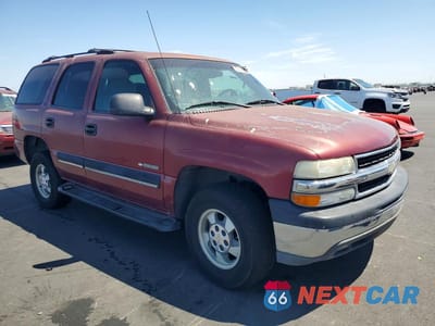 Czwarte zdjęcie samochodu z boku: 2001 CHEVROLET TAHOE C1500 VIN:1GNEC13T01J183704 - miniatura