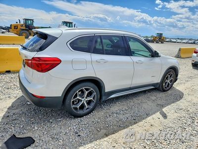 Trzecie zdjęcie samochodu z tyłu: 2016 BMW X1 XDRIVE28I VIN:WBXHT3C30GP887427 - miniatura